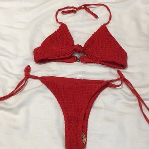 Red two piece bathing suit. Never been worn before